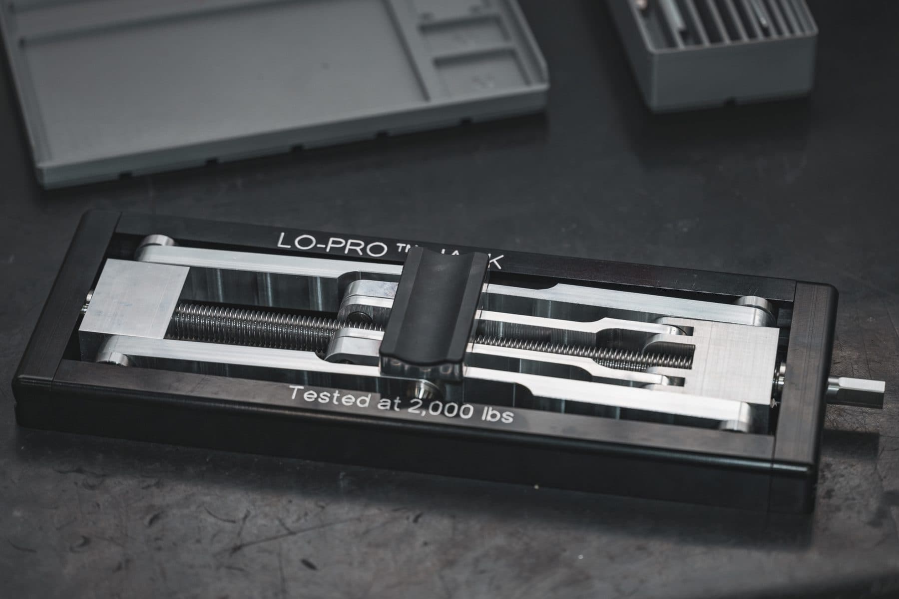 Finished Lo-Pro jack in its housing, marked tested at 2,000 lbs