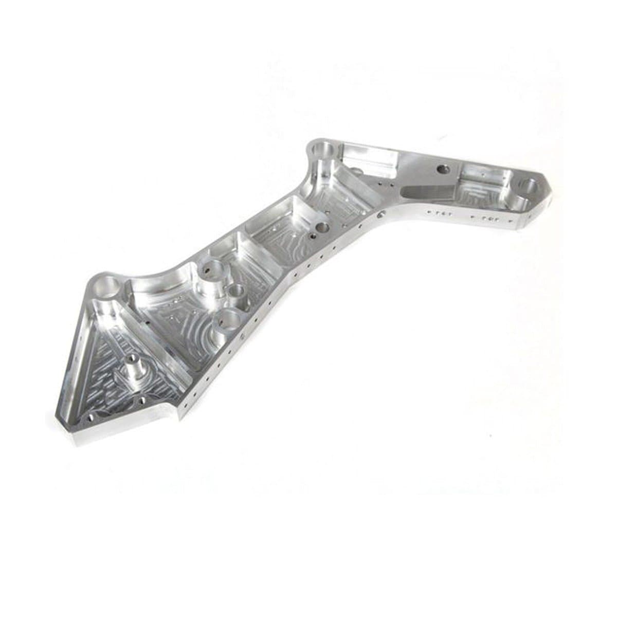 Milled aerospace bracket on a white background