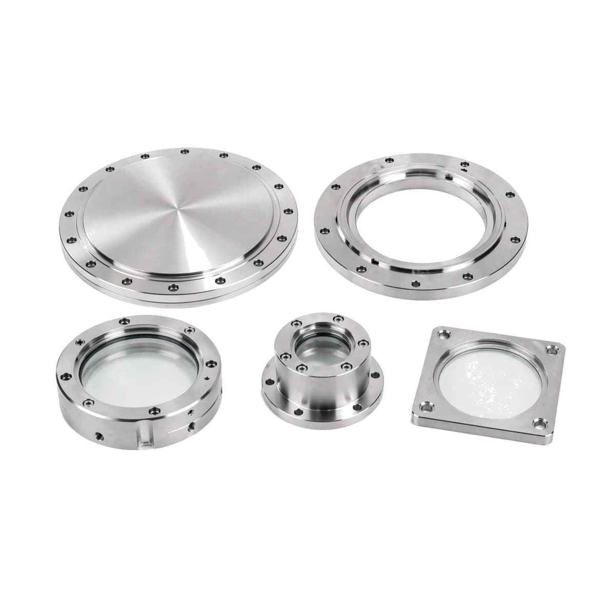 Machined vacuum flanges and viewport lids on a white background